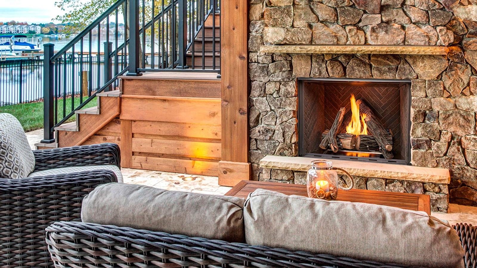 Majestic Courtyard 42" Outdoor Gas Fireplace on lakeside stone patio