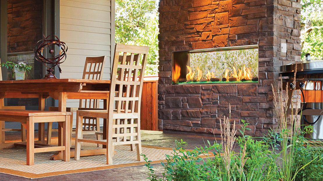 Majestic Lanai 48" Outdoor Linear Gas Fireplace, see-through, in slab-stone hearth wall